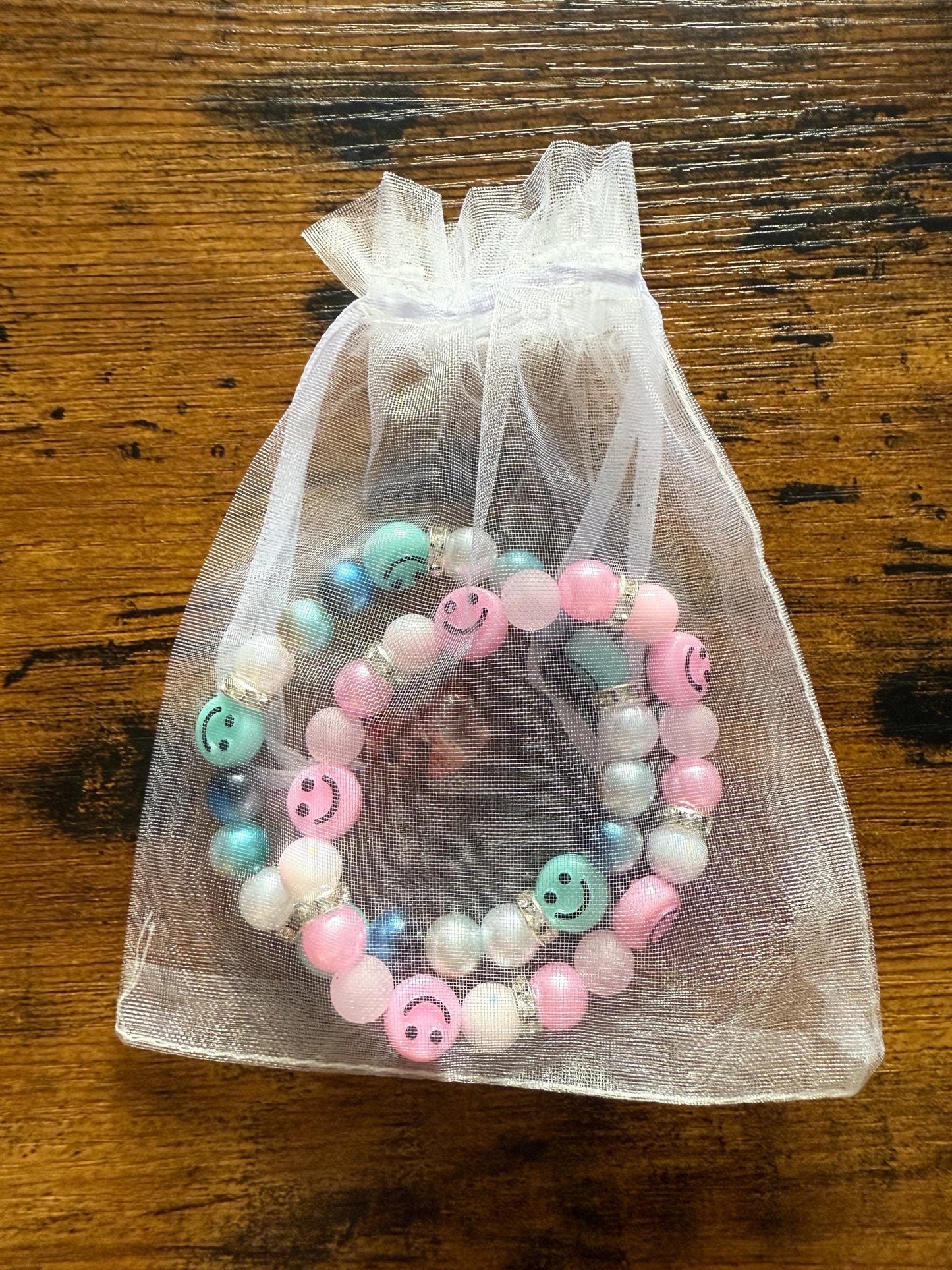 2 x handmade elasticated smiley bead bracelets.